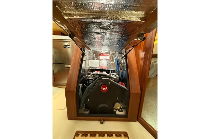 Slide: The Image of Engine compartment of 2025 Island Packet 349 sailboat, showcasing mechanical components. - 31