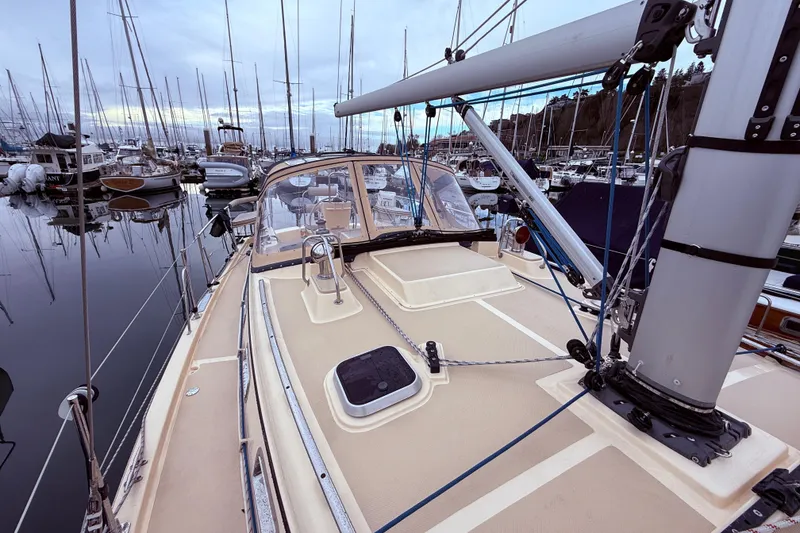 Slide: The Image of 2025 Island Packet 349 sailboat docked in a marina, showcasing deck and rigging. - 8
