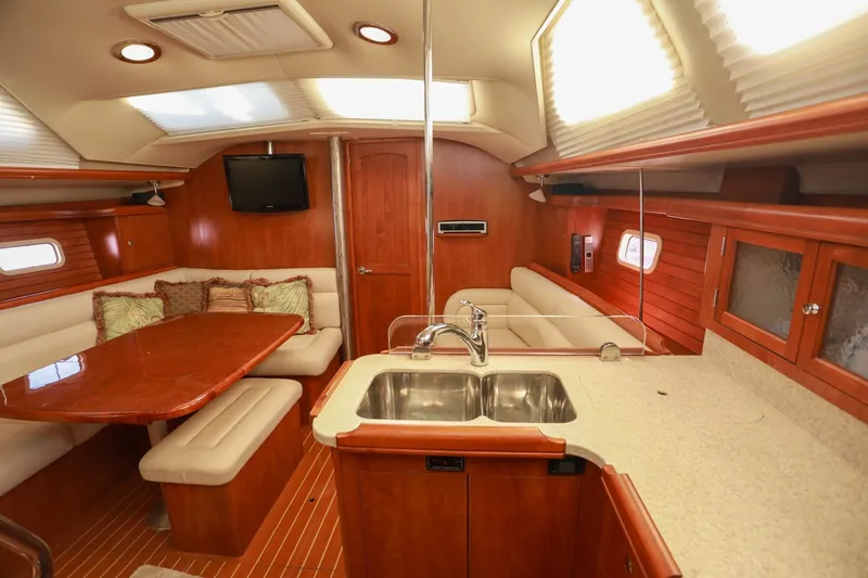 Slide: The Image of Luxurious interior of 2009 Hunter 45 Center Cockpit yacht with elegant wood finish. - 17