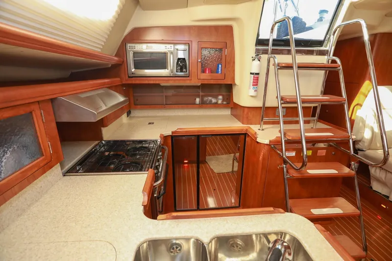 Slide: The Image of Luxurious 2009 Hunter 45 Center Cockpit yacht interior with modern kitchen amenities. - 19
