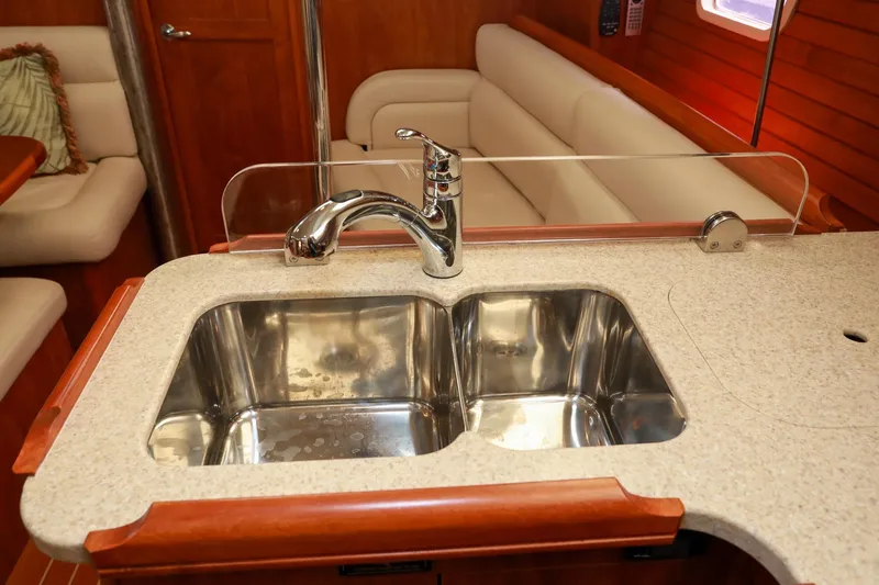 Slide: The Image of Luxurious kitchen sink in 2009 Hunter 45 Center Cockpit yacht interior. - 24