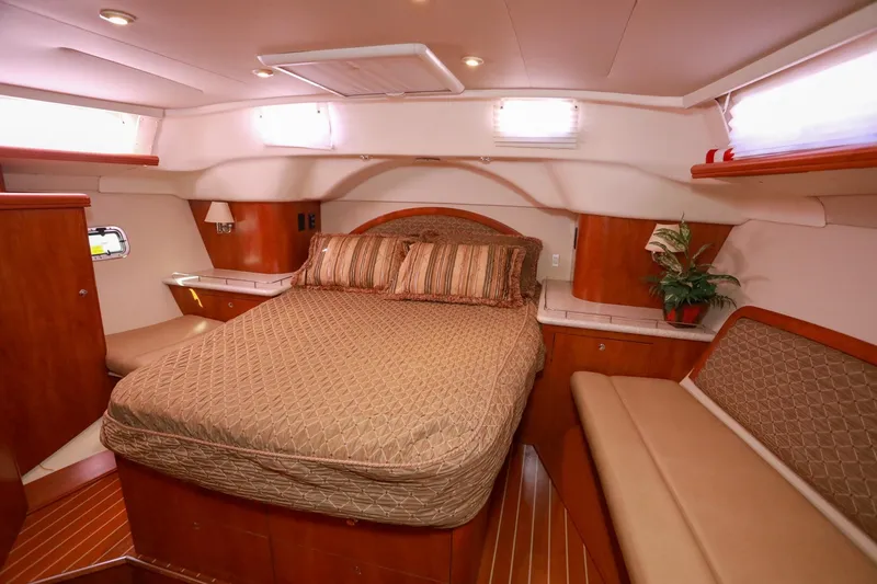 Slide: The Image of Luxurious interior of 2009 Hunter 45 Center Cockpit yacht with cozy bed and elegant wood finish. - 28