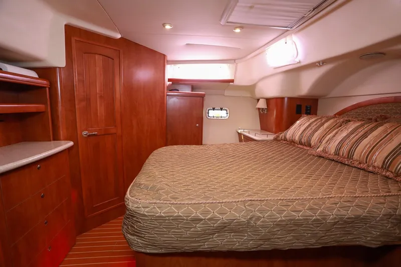 Slide: The Image of Luxurious cabin interior of 2009 Hunter 45 Center Cockpit yacht with wood finish and cozy bed. - 29