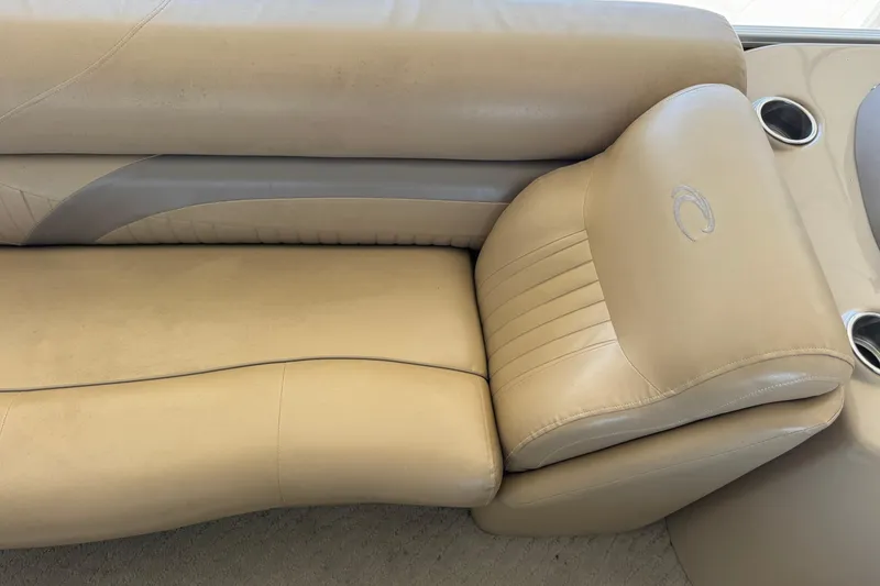 Slide: The Image of Steering console of 2011 Crest 250SLR Caribbean boat with wood accents and control panel. - 11