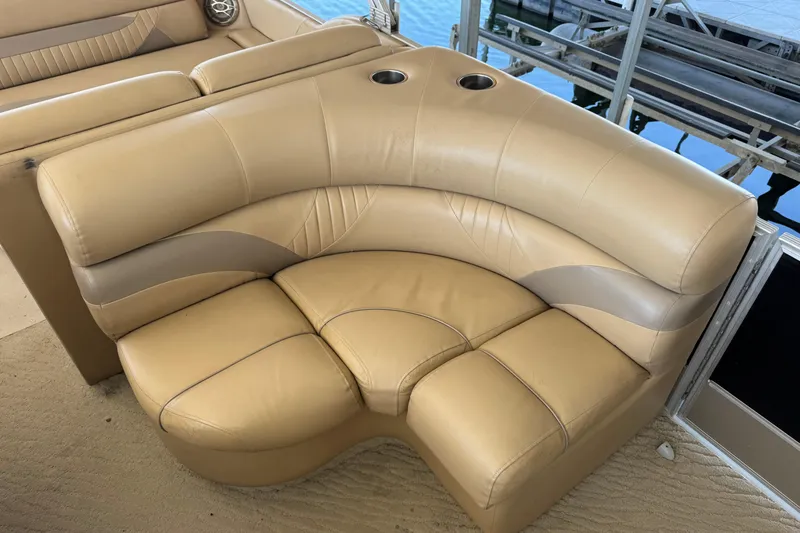 Slide: The Image of Interior of 2011 Crest 250SLR Caribbean boat with beige seating and carpet. - 16