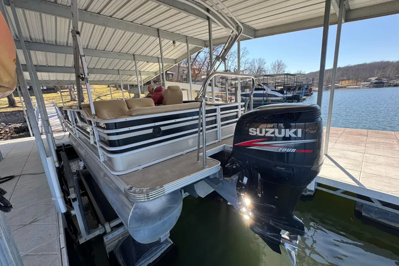 Slide: The Image of Beige leather seating in 2011 Crest 250SLR Caribbean boat with cup holders. - 17