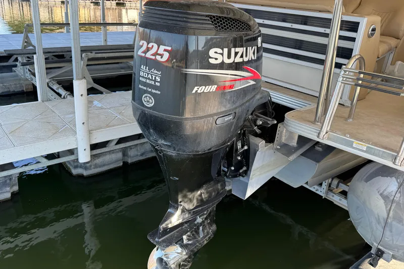 Slide: The Image of 2011 Crest 250SLR Caribbean boat interior with beige seating and water view. - 18