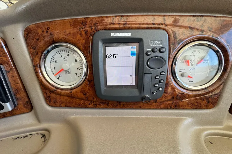 Slide: The Image of 2011 Crest 250 SLR Caribbean pontoon boat docked under a covered structure. - 6