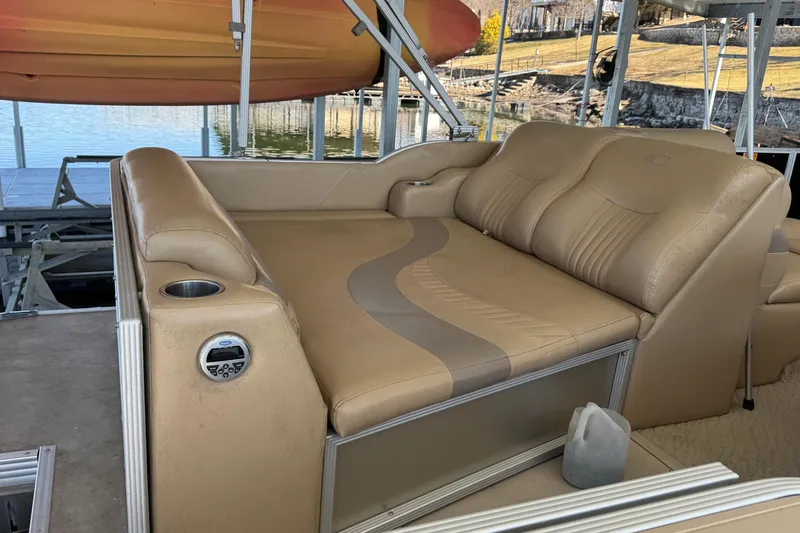 Slide: The Image of Interior of 2011 Crest 250SLR Caribbean boat with beige seating and steering console. - 8