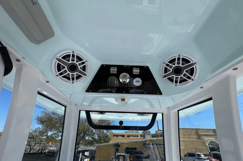 Slide: The Image of 2025 Sportsman Heritage 261 Center Console interior with speakers and control panel. - 18