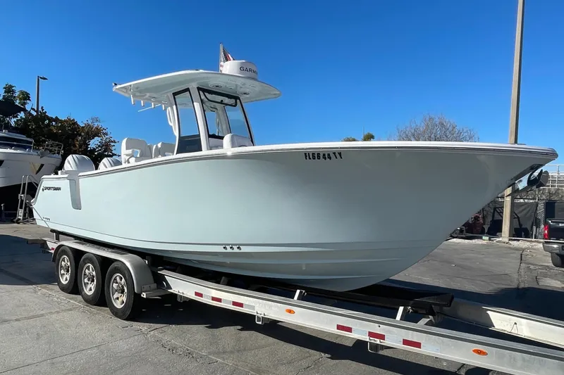 Slide: The Image of 2025 Sportsman Heritage 261 Center Console boat with Yamaha engines on a trailer. - 2