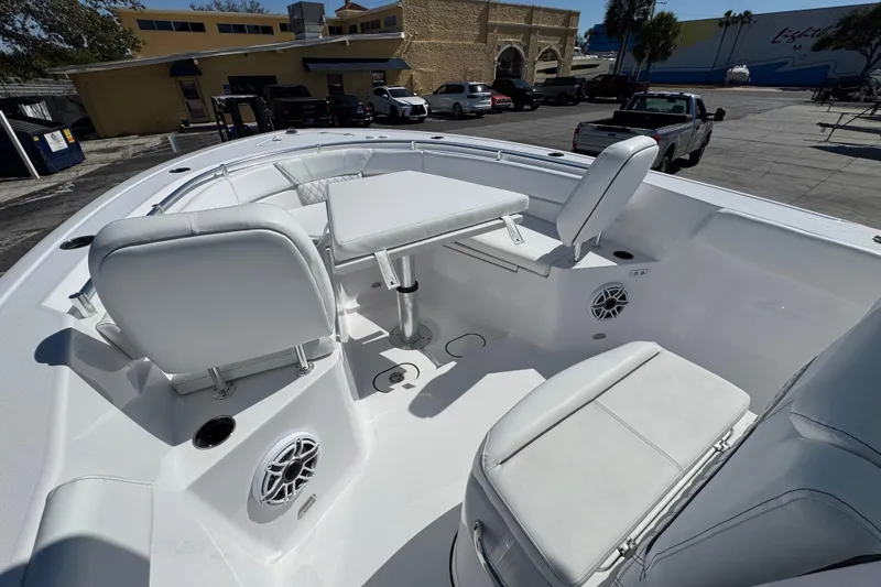 Slide: The Image of 2025 Sportsman Heritage 261 Center Console boat interior with seating and table. - 20