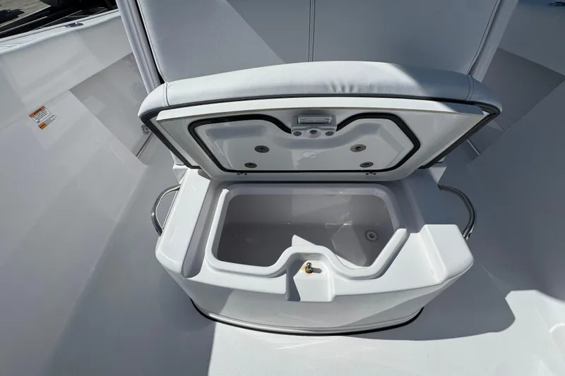 Slide: The Image of 2025 Sportsman Heritage 261 Center Console boat with open storage compartment. - 22