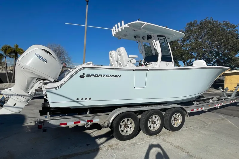 Slide: The Image of 2025 Sportsman Heritage 261 Center Console boat on trailer, featuring Yamaha engine. - 3