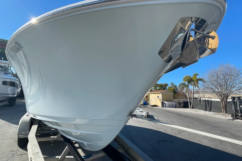 Slide: The Image of 2025 Sportsman Heritage 261 Center Console boat on trailer under clear blue sky. - 6