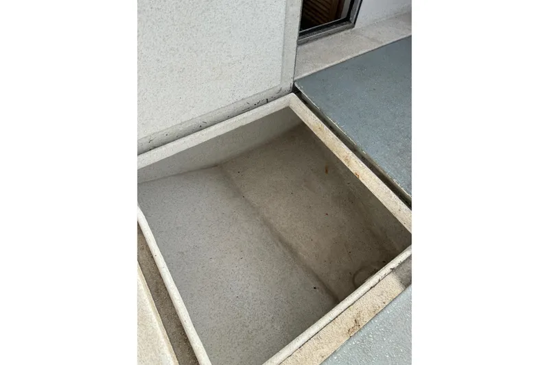 Slide: The Image of Open storage compartment on 1999 SeaSport Seamaster 2700 boat. - 11