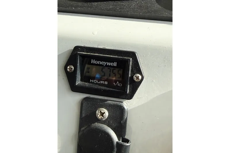 Slide: The Image of Hour meter on 1999 SeaSport Seamaster 2700, displaying 5755 hours. - 21