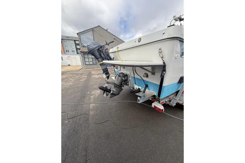 Slide: The Image of 1999 SeaSport Seamaster 2700 boat with Yamaha outboard motor on trailer. - 3