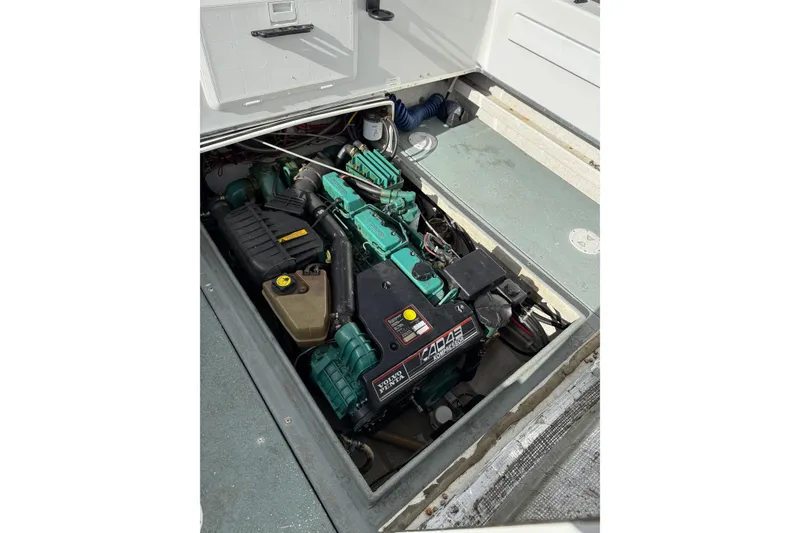 Slide: The Image of Engine compartment of a 1999 SeaSport Seamaster 2700 boat, featuring a Volvo Penta engine. - 9