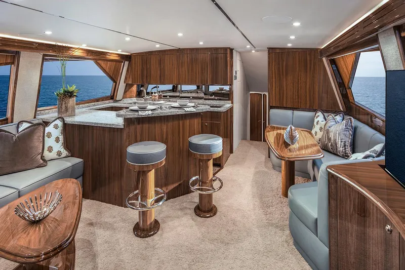 Slide: The Image of Manufacturer Provided Image: Luxurious interior of 2026 Viking 58 Convertible yacht with elegant wood finishes and ocean view. - 11
