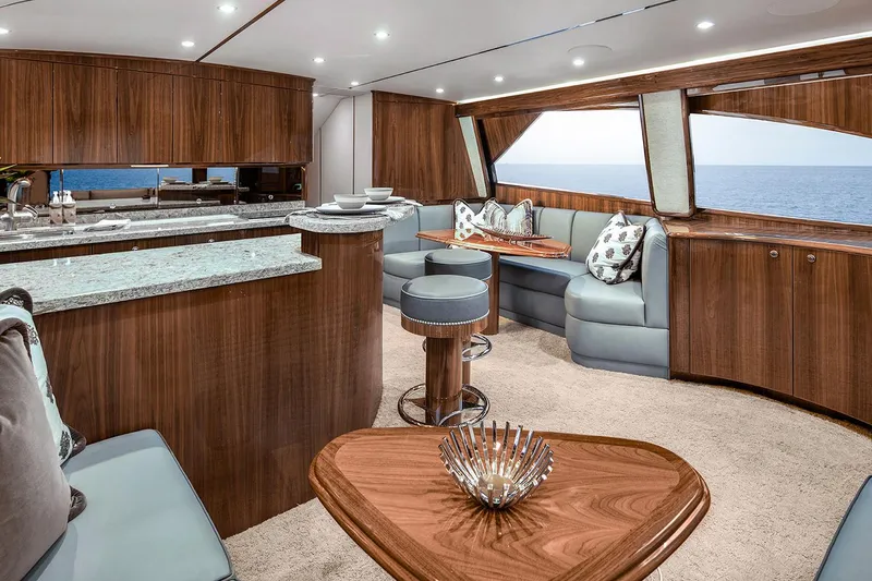 Slide: The Image of Manufacturer Provided Image: Luxurious interior of 2026 Viking 58 Convertible yacht with elegant wood finishes and ocean view. - 12