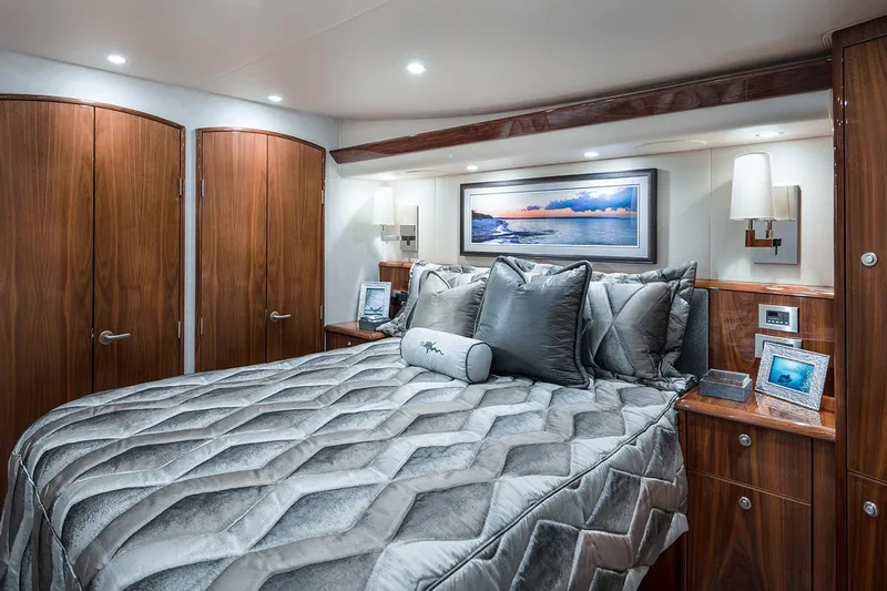 Slide: The Image of Manufacturer Provided Image: Luxurious bedroom interior of 2026 Viking 58 Convertible yacht with elegant wood finishes. - 15
