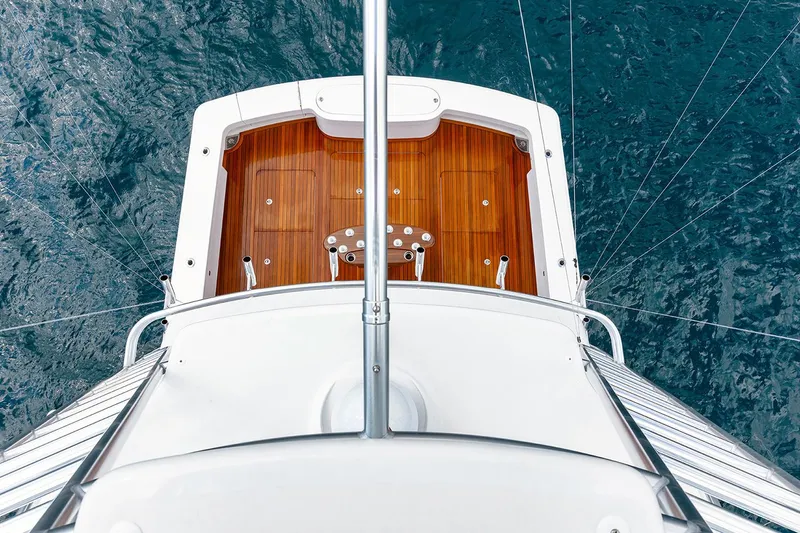Slide: The Image of Manufacturer Provided Image: Aerial view of 2026 Viking 58 Convertible yacht deck over ocean. - 7