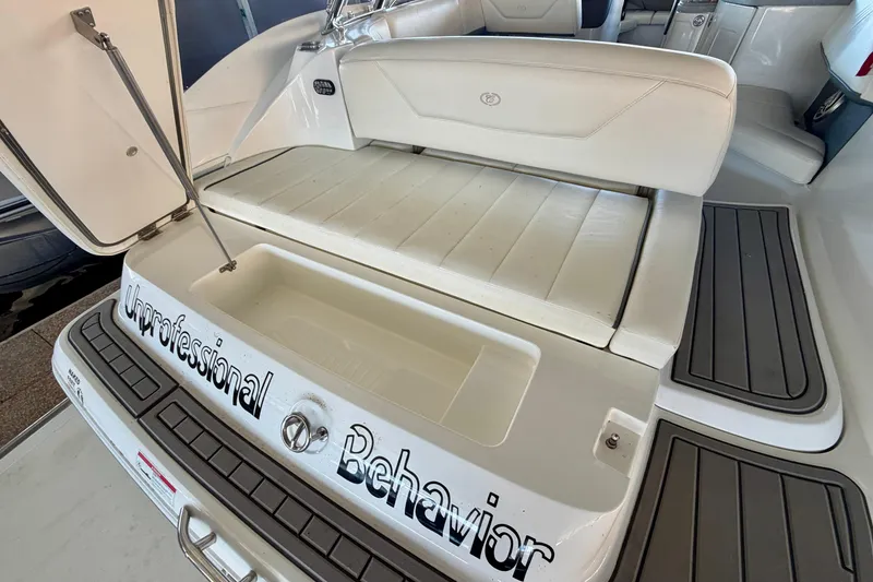 Slide: The Image of 2007 Cobalt 302 boat interior with "Unprofessional Behavior" text on the deck. - 11