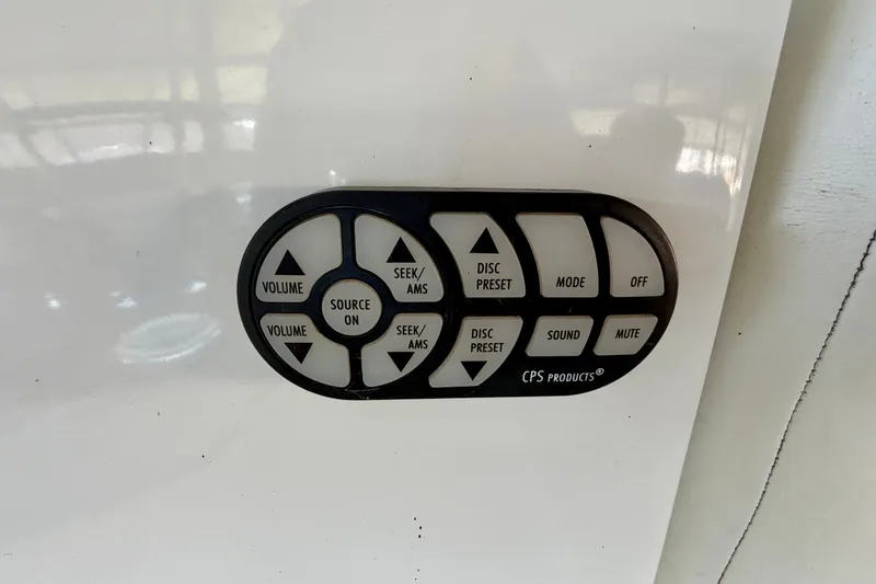 Slide: The Image of Audio control panel with buttons for volume, source, and mode on a 2007 Cobalt 302. - 12