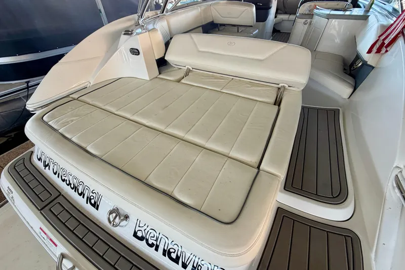 Slide: The Image of 2007 Cobalt 302 boat interior with cushioned seating and sleek design. - 13