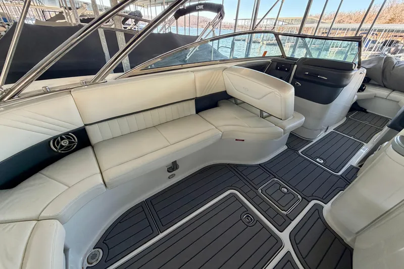 Slide: The Image of Luxurious interior of a 2007 Cobalt 302 boat with white seating and sleek design. - 17