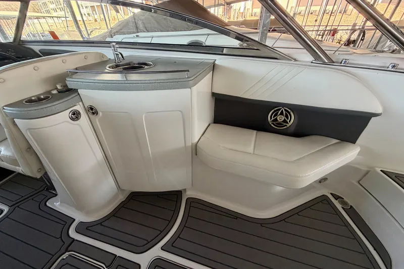 Slide: The Image of 2007 Cobalt 302 boat interior with seating and sink area. - 19