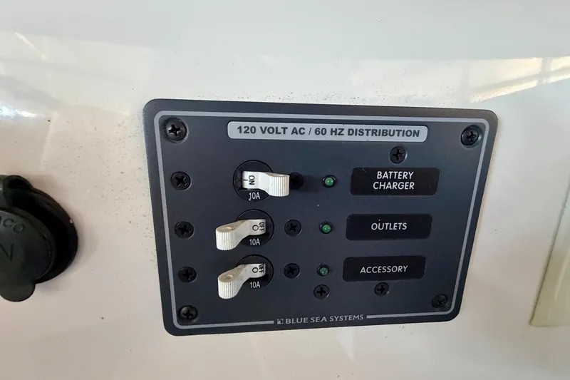 Slide: The Image of 120V AC distribution panel on 2007 Cobalt 302 boat by Blue Sea Systems. - 21