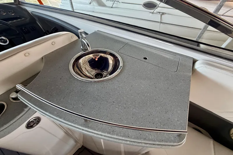 Slide: The Image of 2007 Cobalt 302 boat interior with sleek countertop and built-in sink. - 23