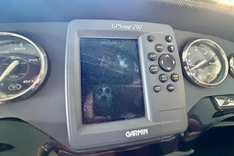 Slide: The Image of Dashboard of a 2007 Cobalt 302 with Garmin GPSmap 292 and gauges. - 28