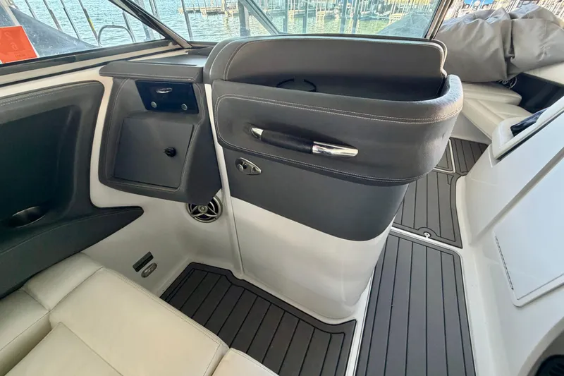 Slide: The Image of Interior of a 2007 Cobalt 302 boat, featuring sleek seating and modern design. - 29