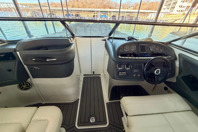 Slide: The Image of Interior view of a 2007 Cobalt 302 boat cockpit with steering wheel and dashboard. - 33