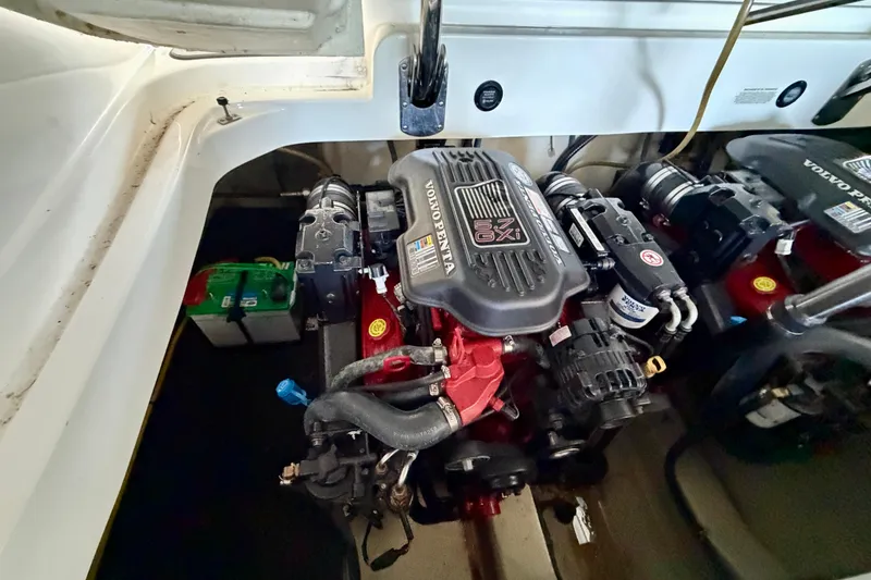 Slide: The Image of Engine compartment of a 2007 Cobalt 302 boat featuring a Volvo Penta 5.7 GXI engine. - 44