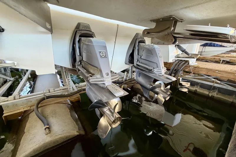 Slide: The Image of 2007 Cobalt 302 boat with dual Volvo Penta outdrives in a marina setting. - 7