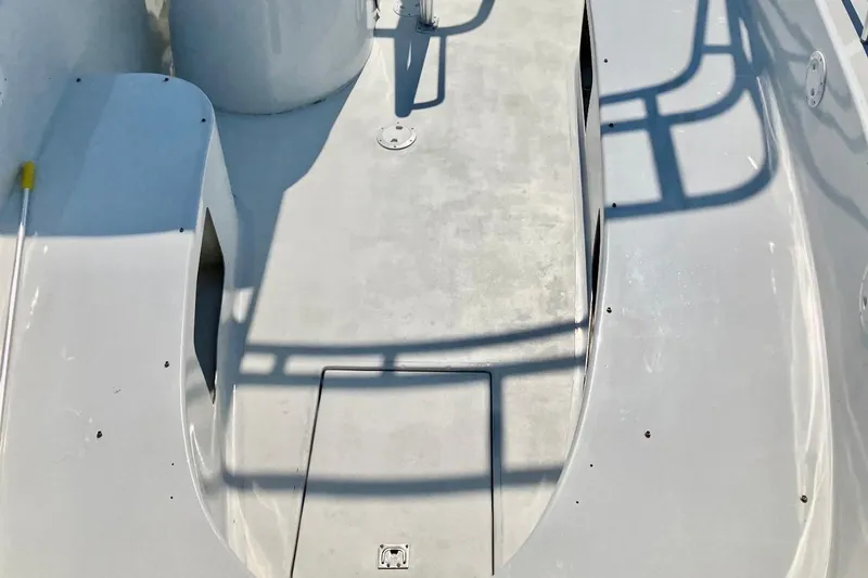 Slide: The Image of Deck of a 2003 O.C. Parasail 28 boat with shadows and clean surface. - 11