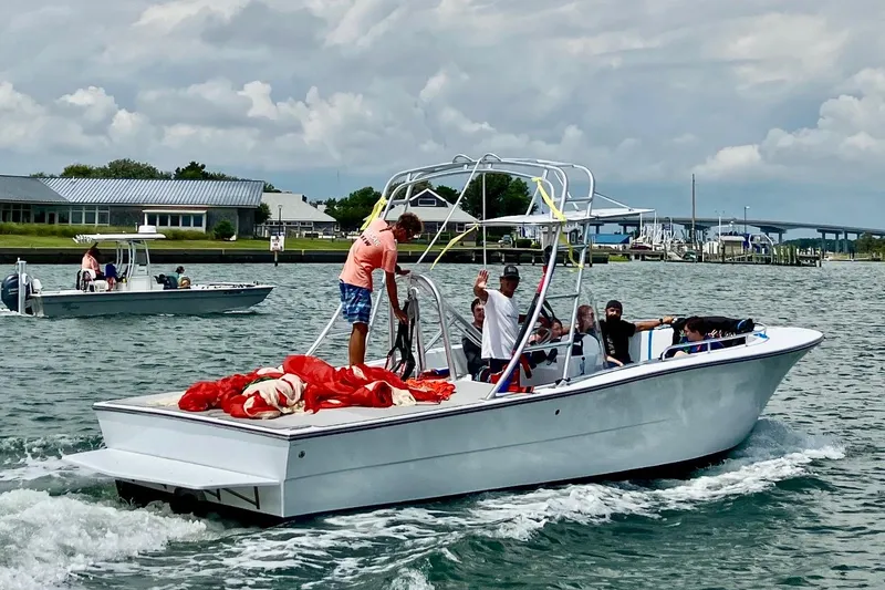Slide: The Image of Boat on water with passengers, O.C. Parasail 28, 2003 model, preparing for parasailing. - 2
