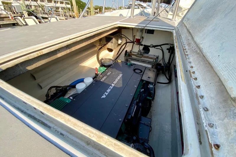 Slide: The Image of Engine compartment of a 2003 Custom O.C. Parasail 28, featuring a Volvo Penta engine. - 21