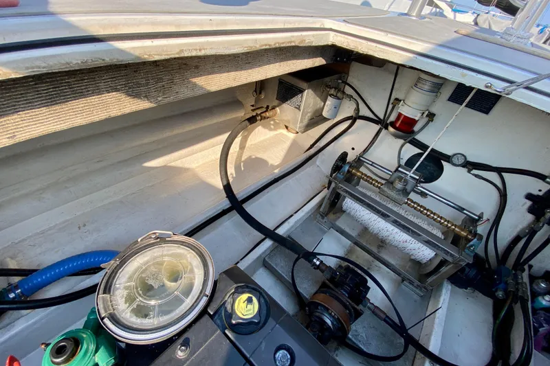 Slide: The Image of Interior view of a 2003 Custom O.C. Parasail 28 boat, showcasing mechanical components. - 25