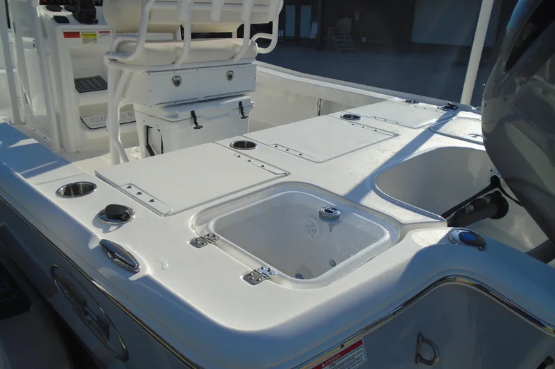 Slide: The Image of 2023 Sea Hunt BX 22 BR boat interior with seating and storage compartments. - 10