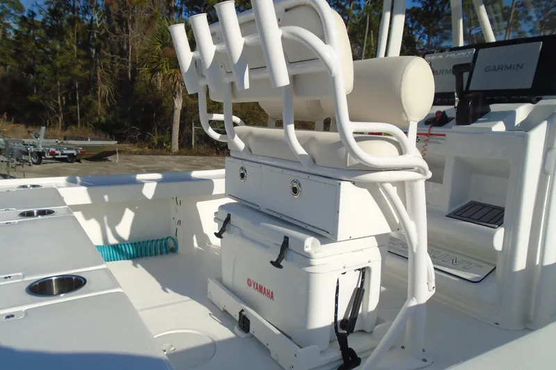 Slide: The Image of 2023 Sea Hunt BX 22 BR boat interior with seating and storage features. - 11