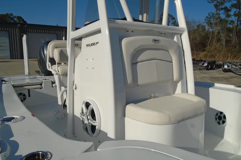 Slide: The Image of 2023 Sea Hunt BX 22 BR boat interior with seating and speakers. - 12