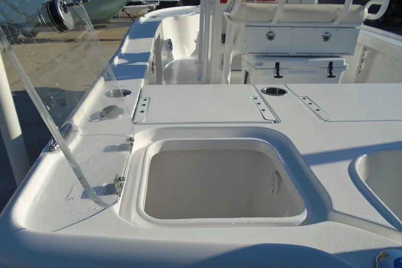 Slide: The Image of 2023 Sea Hunt BX 22 BR boat interior with storage compartments and seating. - 15