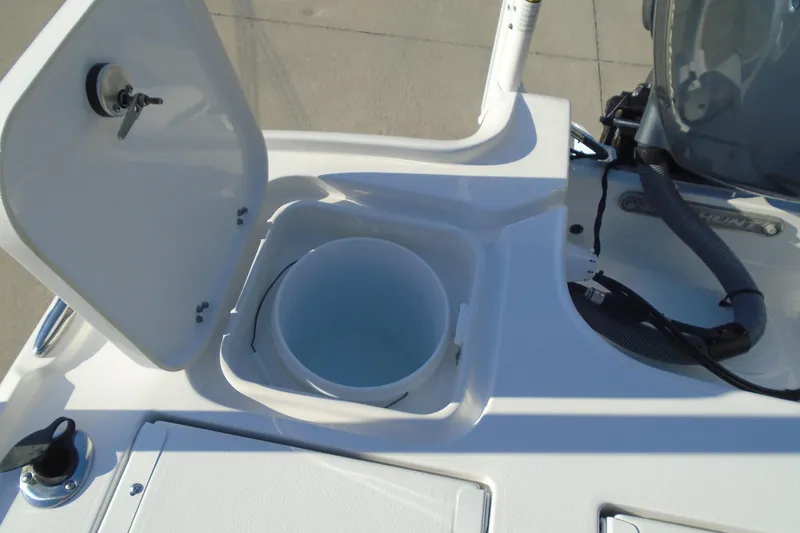 Slide: The Image of 2023 Sea Hunt BX 22 BR boat with open storage compartment and bucket. - 16