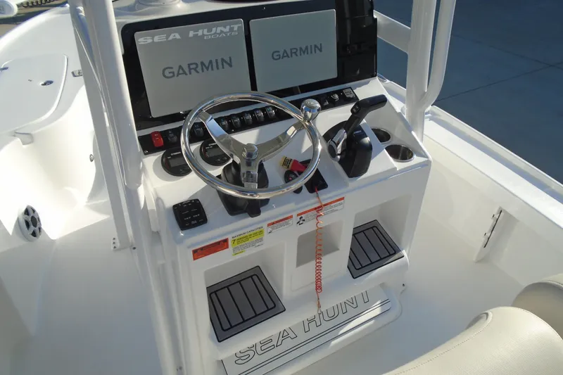 Slide: The Image of 2023 Sea Hunt BX 22 BR boat console with Garmin displays and steering wheel. - 19