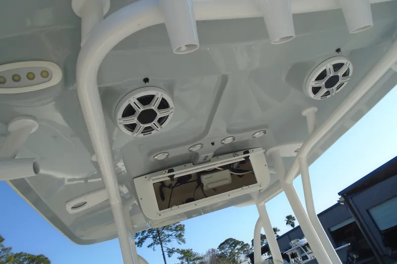Slide: The Image of 2023 Sea Hunt BX 22 BR boat T-top with speakers and rod holders. - 20